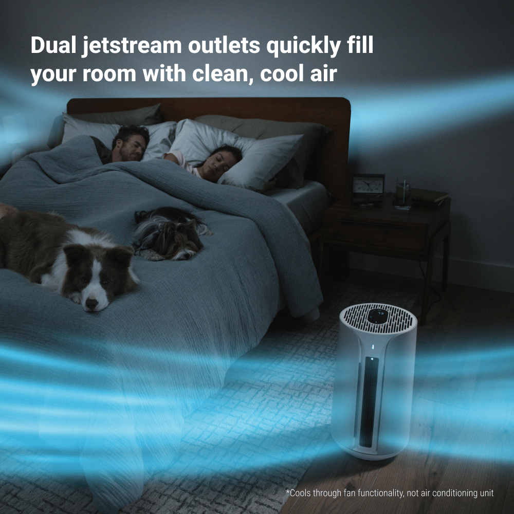 Air purifier in a bedroom with people and dogs resting, highlighting dual jetstream outlets.