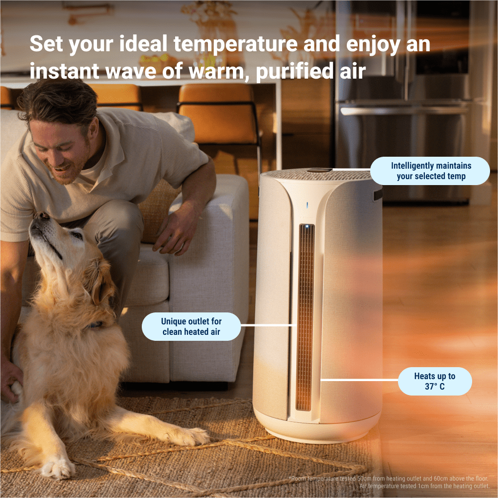 Person and dog with a home air purifier in a living room setting