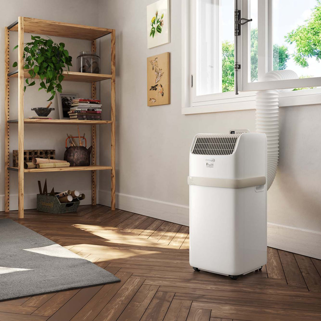 De'Longhi Pinguino Compact PACES72 Classic Portable Air Conditioner & Dehumidifier on the Floor - Aerify