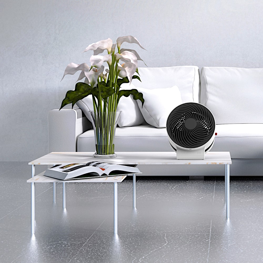 Boneco F100 Desktop Air Shower Fan On Table In Living Room - Aerify