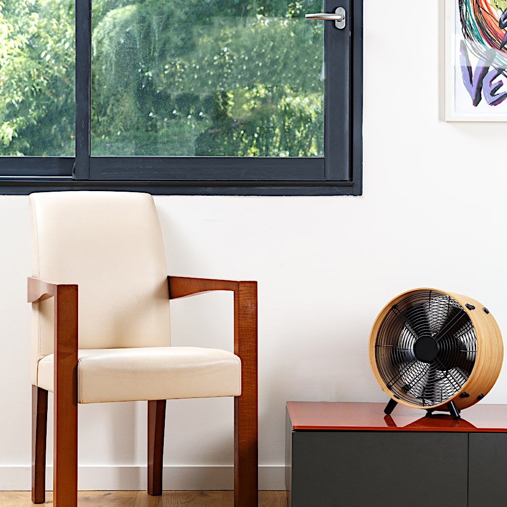 Stadler Form Otto Bamboo Floor Fan On Table in Living Room - Aerify